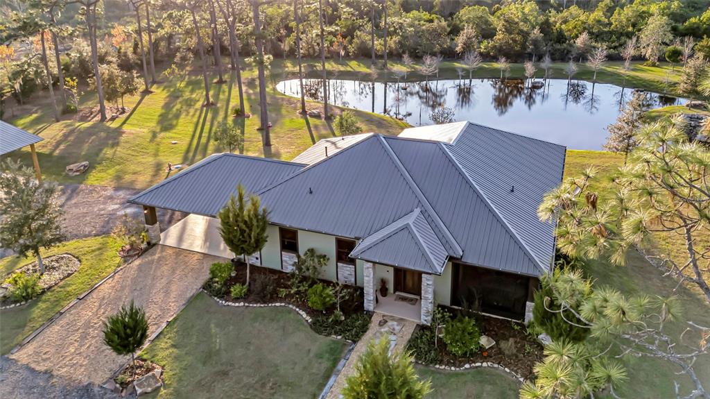 7330 Crabgrass Road St. Cloud, FL 34773 - Photo 42 of 60 an aerial view of house with lake view and a yard