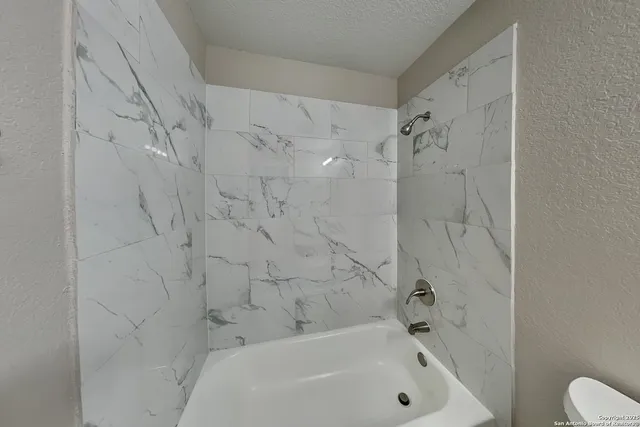 a bathroom with a bathtub