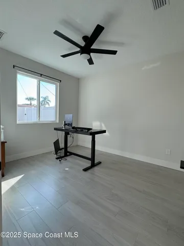 a bedroom with a bed and dresser