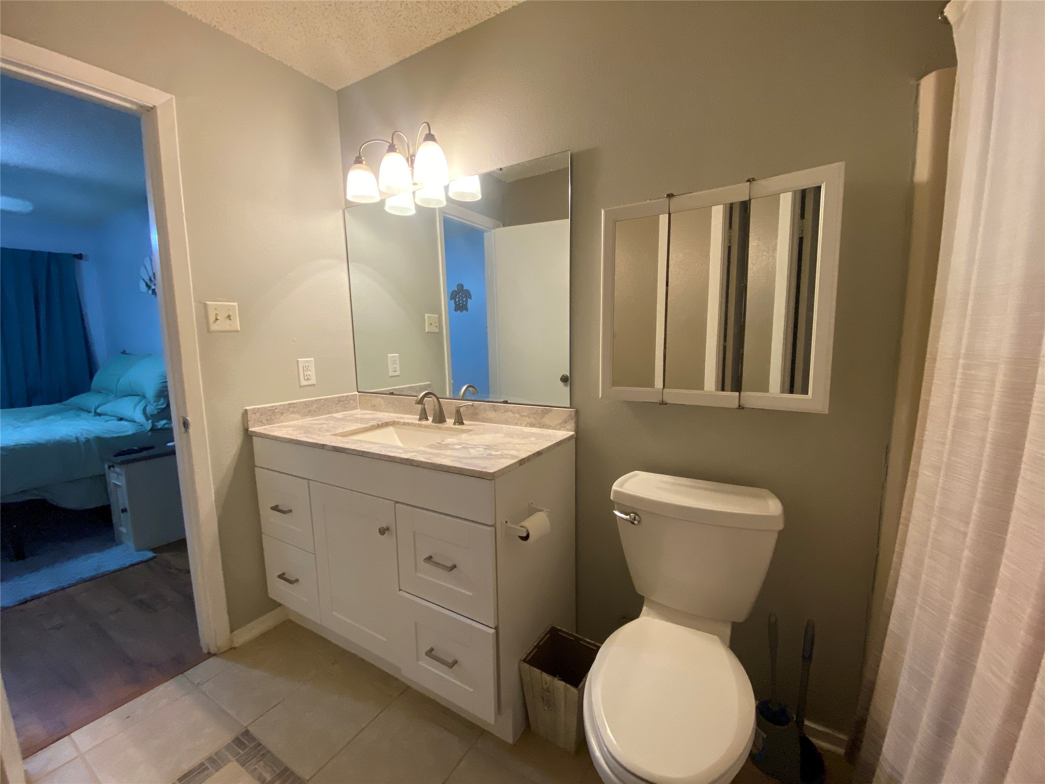 28604 Magnolia Court Point Blank, TX 77364 - Photo 12 of 30 a bathroom with a toilet sink and mirror