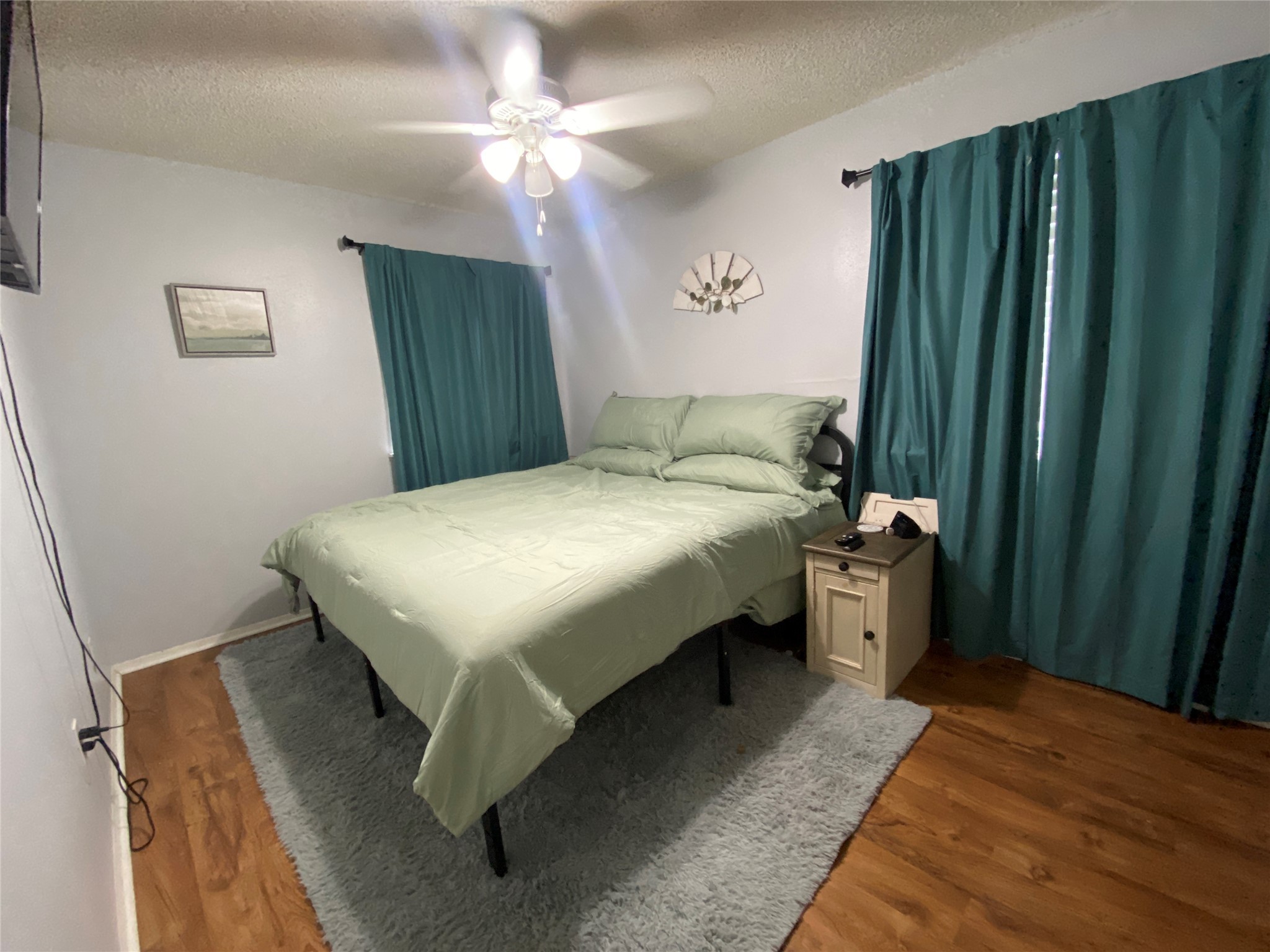 28604 Magnolia Court Point Blank, TX 77364 - Photo 16 of 30 a bedroom with a bed and a window