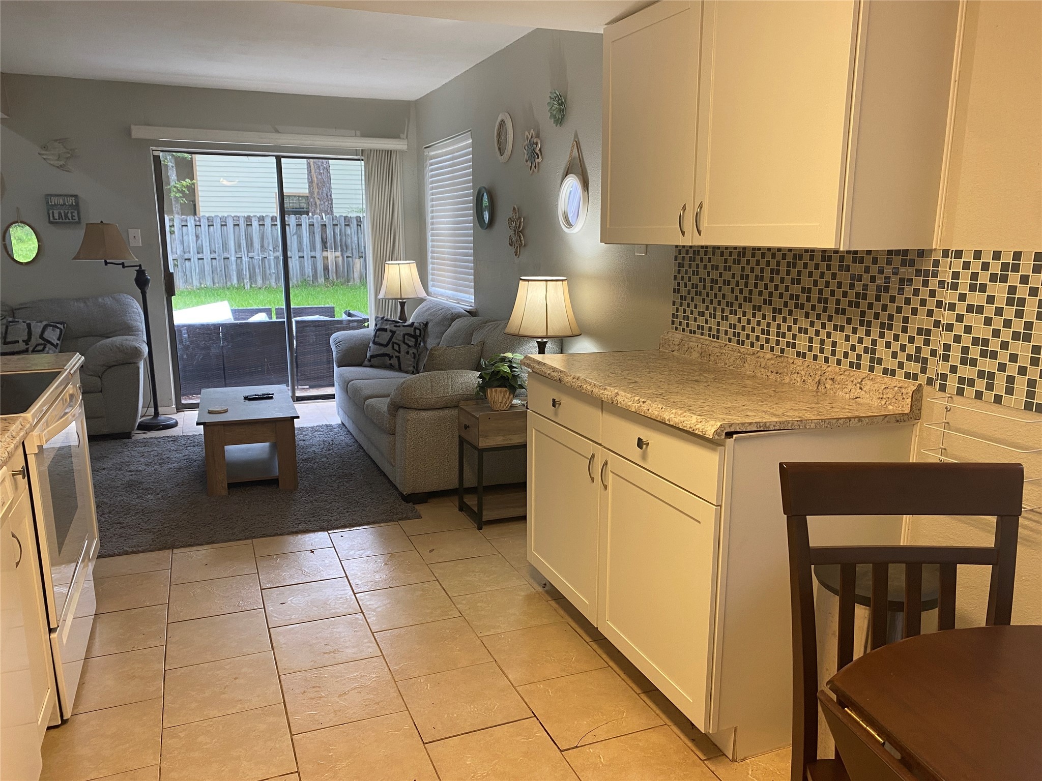 28604 Magnolia Court Point Blank, TX 77364 - Photo 18 of 30 a kitchen with a stove a sink and a refrigerator