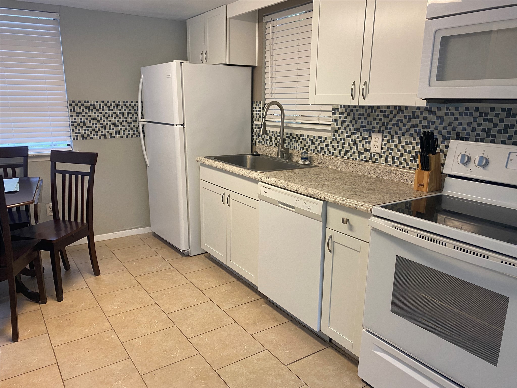 28604 Magnolia Court Point Blank, TX 77364 - Photo 21 of 30 a kitchen with cabinets and a refrigerator