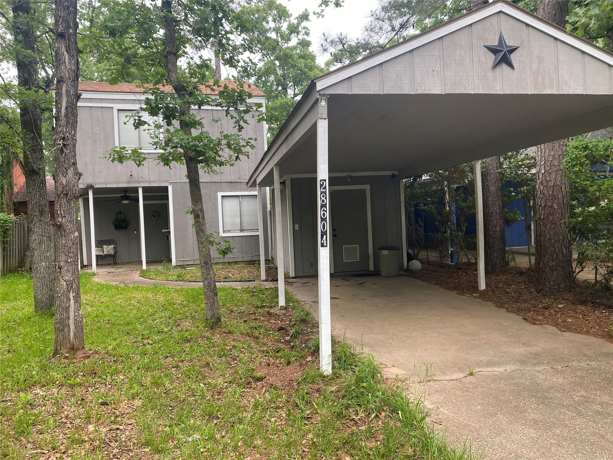 28604 Magnolia Court Point Blank, TX 77364 - Photo 29 of 30 a backyard of a house with plants and large tree