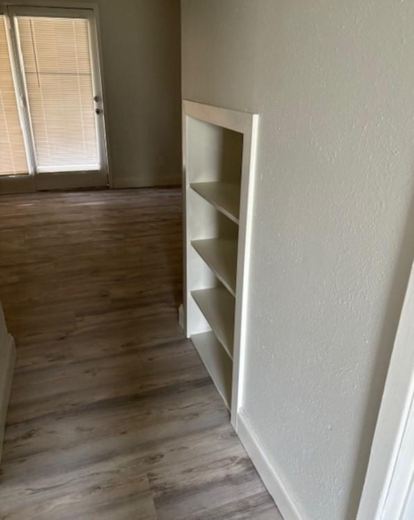 2729 Hurstview Drive, Unit A Hurst, TX 76054 - Photo 7 of 21 Hallway with shelving