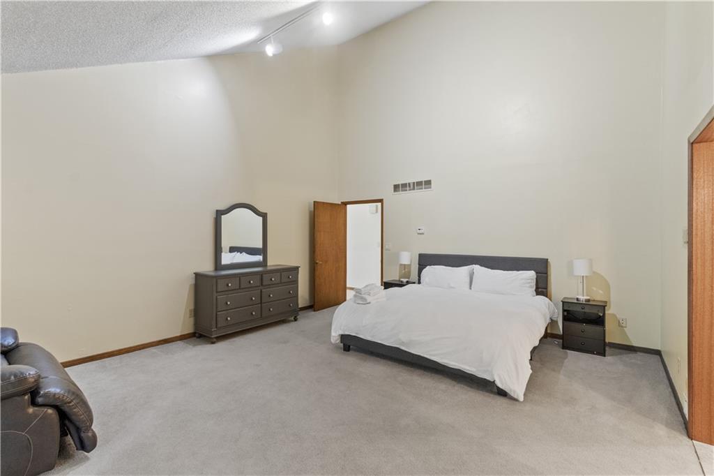 3711 Frey Lake Road Northwest Kennesaw, GA 30144 - Photo 18 of 37 a bedroom with a bed table and a couch