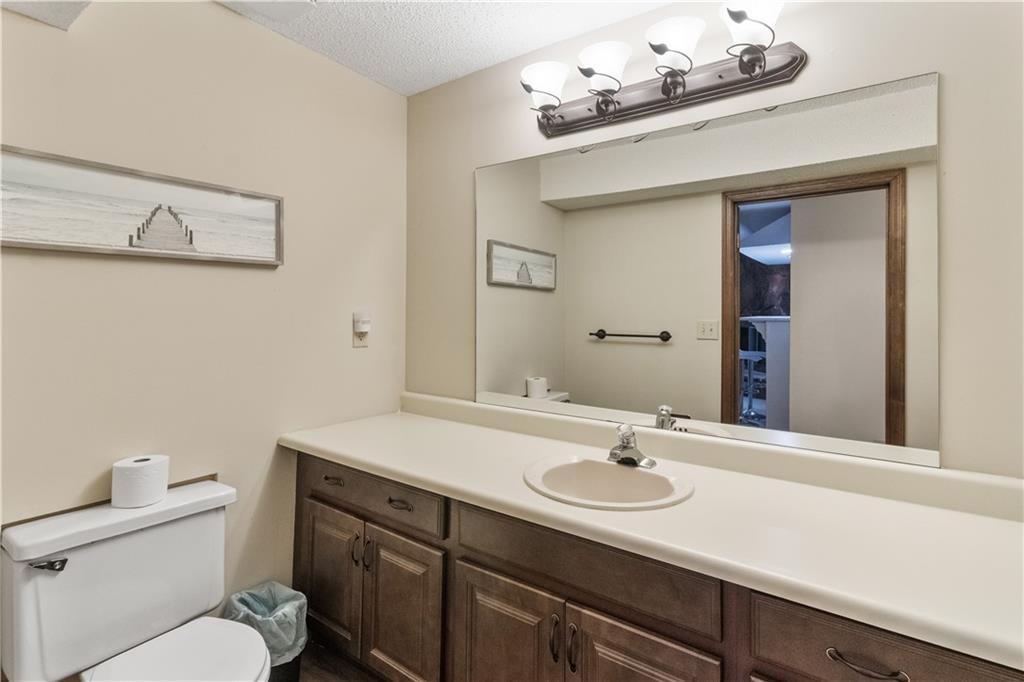 3711 Frey Lake Road Northwest Kennesaw, GA 30144 - Photo 27 of 37 a bathroom with a sink vanity granite and toilet