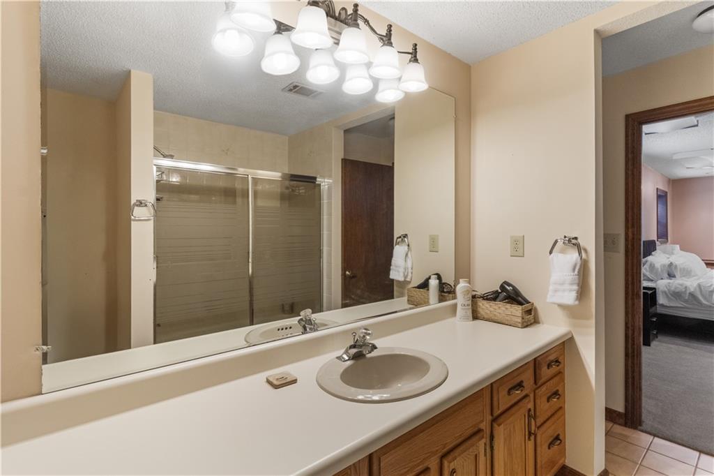 3711 Frey Lake Road Northwest Kennesaw, GA 30144 - Photo 31 of 37 a bathroom with a granite countertop sink and a mirror