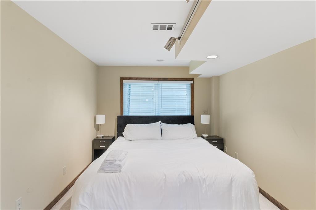 3711 Frey Lake Road Northwest Kennesaw, GA 30144 - Photo 33 of 37 a bedroom with a bed and window