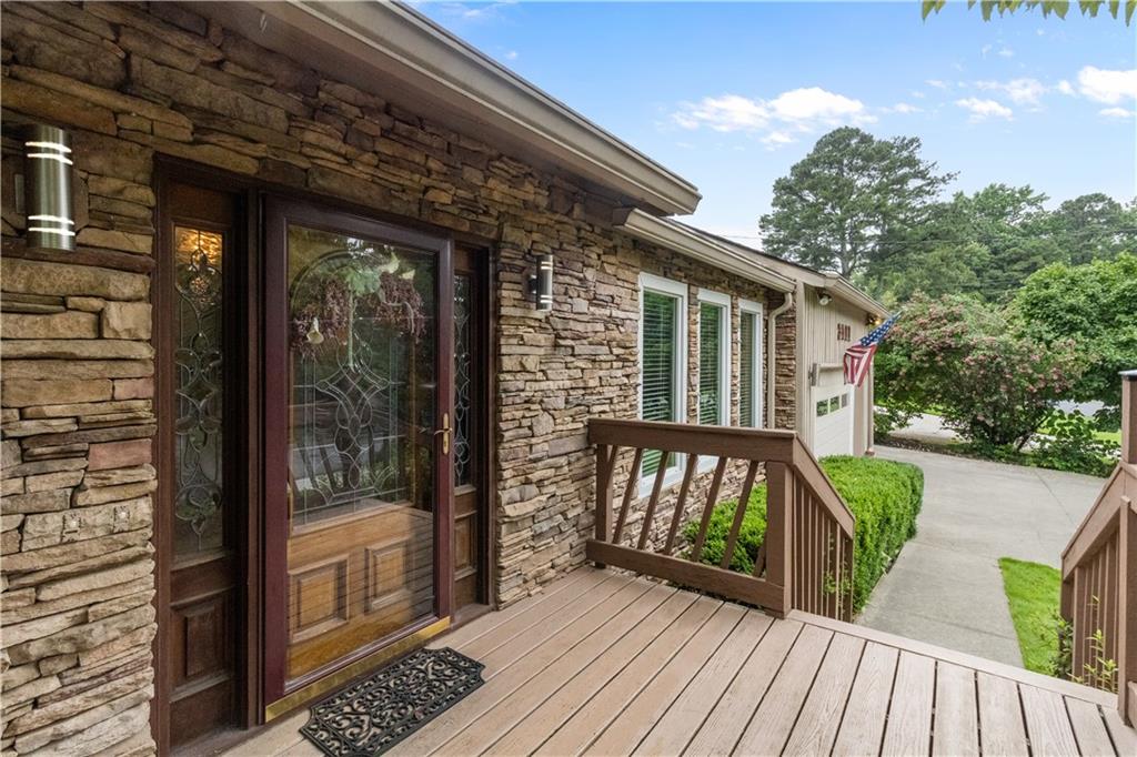 3711 Frey Lake Road Northwest Kennesaw, GA 30144 - Photo 4 of 37 a balcony with wooden floor and outdoor space
