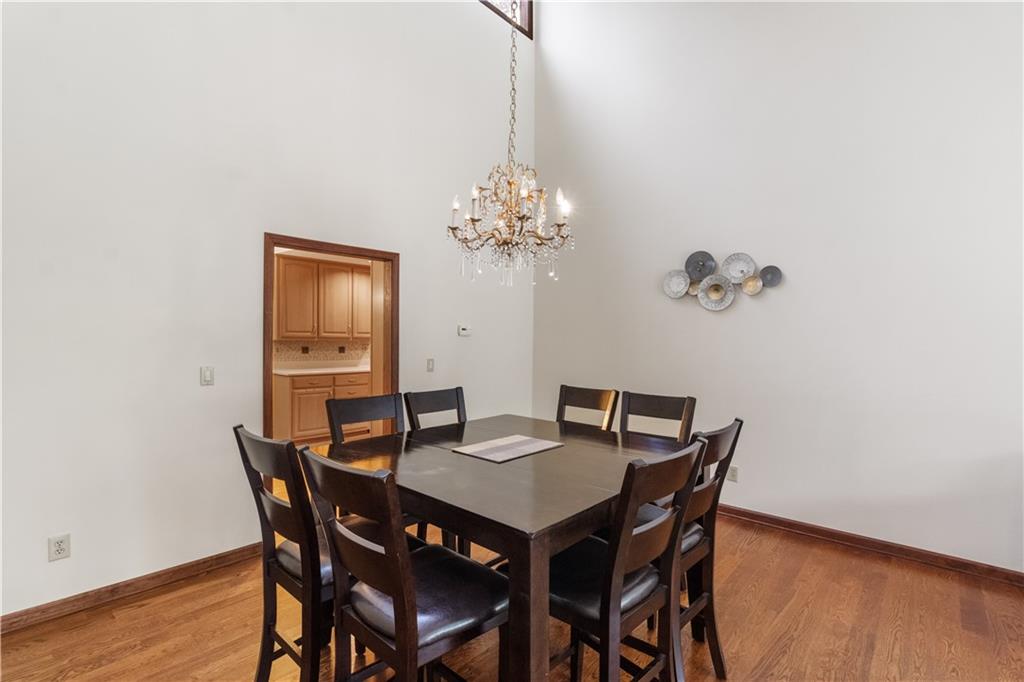 3711 Frey Lake Road Northwest Kennesaw, GA 30144 - Photo 7 of 37 a view of a dining room with furniture and wooden floor