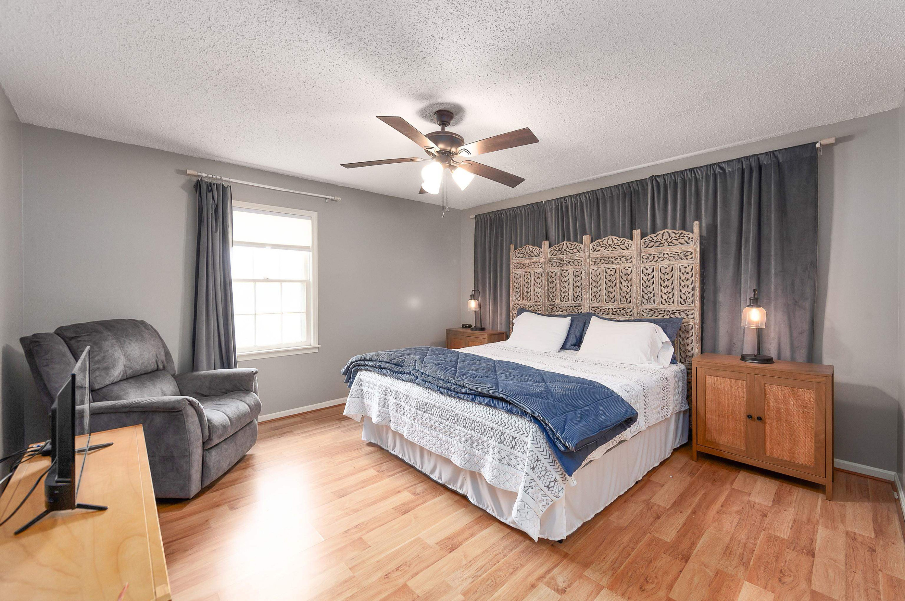 835 Smith Road Luray, TN 38352 - Photo 13 of 19 a bed room with a bed and a chair