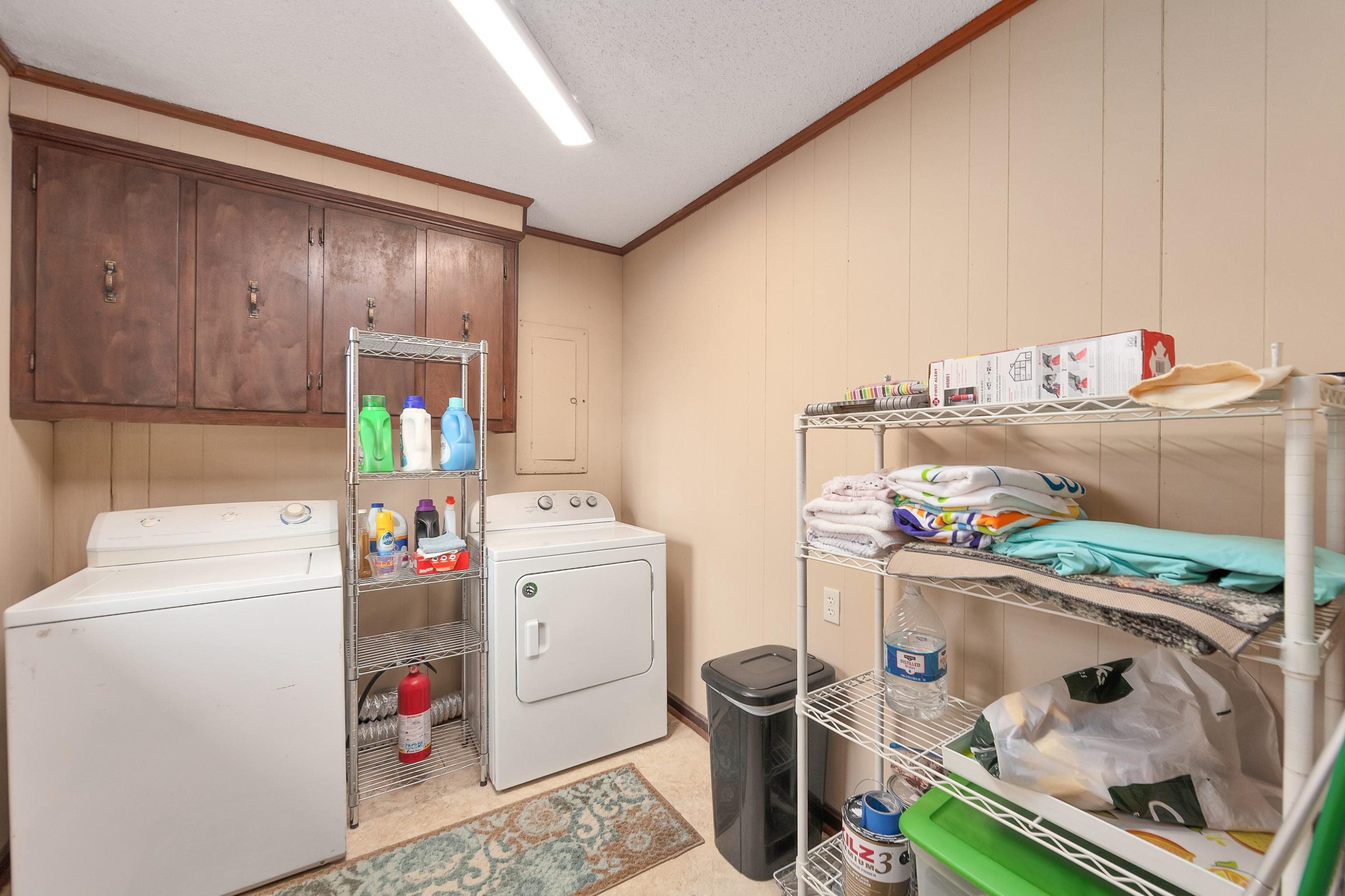 835 Smith Road Luray, TN 38352 - Photo 9 of 19 a storage room with washer and dryer