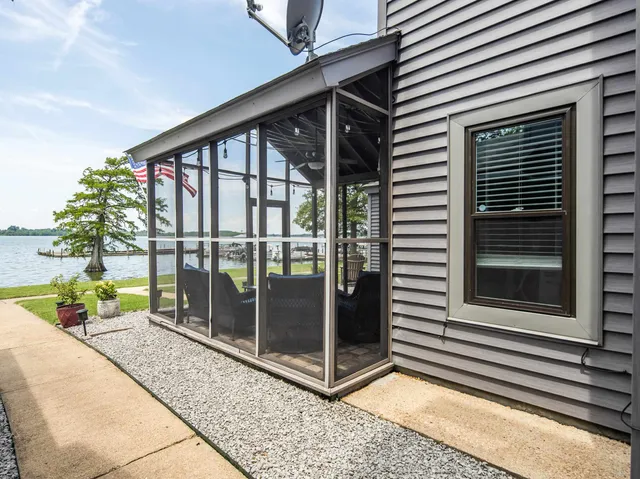 a view of a swimming pool with a yard