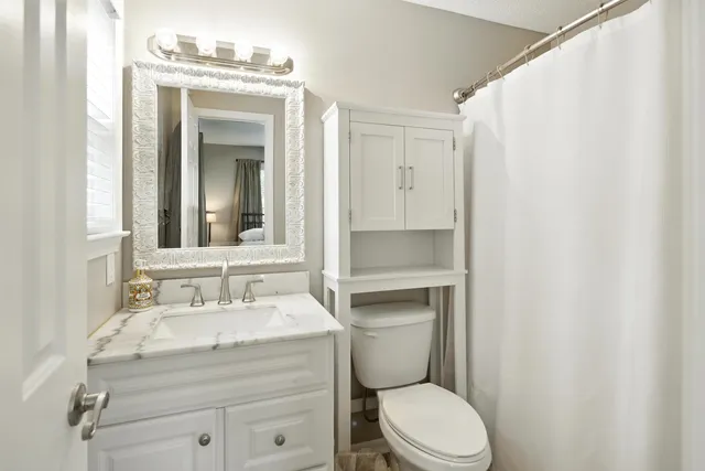 a bathroom with a bathtub and toilet