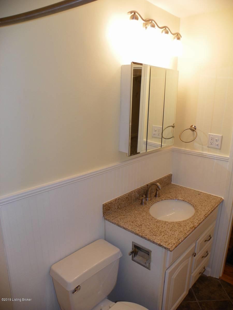 14412 Oldham Acres Road Prospect, KY 40059 - Photo 22 of 42 Remodeled full bath with newer paint, custom ceramic tile, vanity w/granite top and newer fixtures.