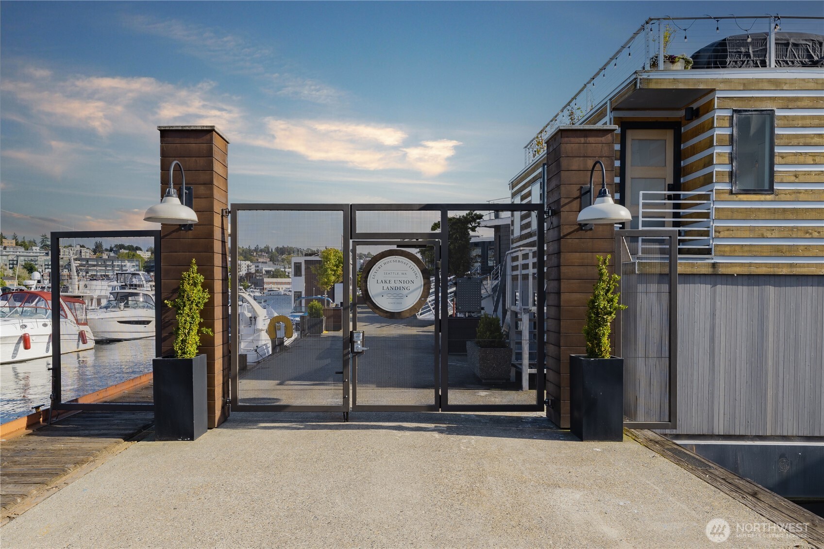 2309 North Northlake Way, Unit 12 Seattle, WA 98103 - Photo 2 of 9 a house with trees in front of it