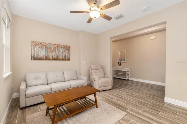 a living room with furniture and a table