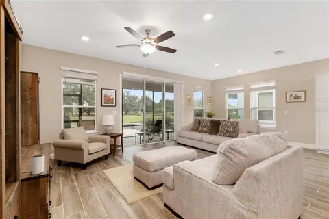 a living room with furniture and a window