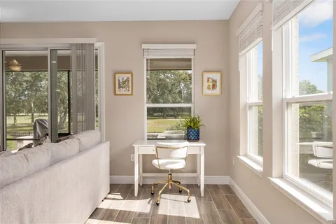 a large kitchen with a table and chairs