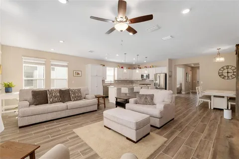 a kitchen with stainless steel appliances granite countertop a kitchen island a stove and a sink