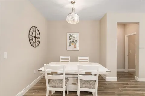 a kitchen with granite countertop a sink a stove and microwave