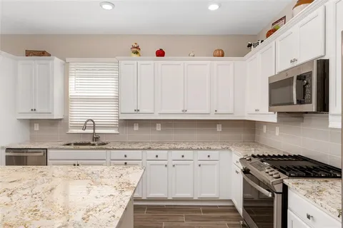 a bathroom with a sink and shower