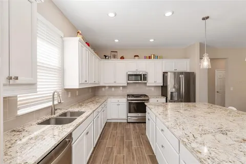 a bathroom with a sink vanity and a mirror