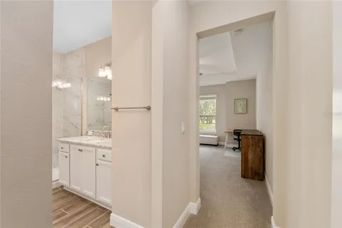 a bathroom with a granite countertop sink a shower and a mirror