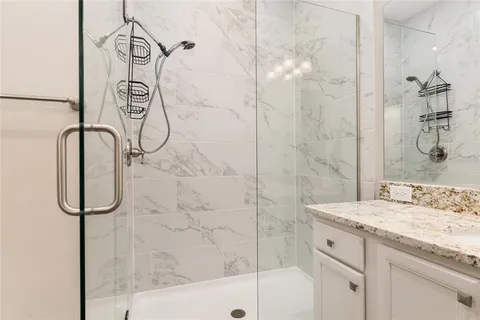 a bathroom with a tub and a shower