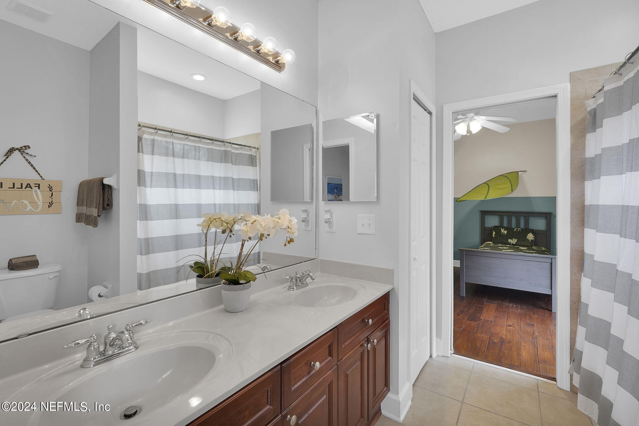 2024 River's Own Road St. Augustine, FL 32092 - Photo 30 of 73 a bathroom with a sink double vanity and a mirror