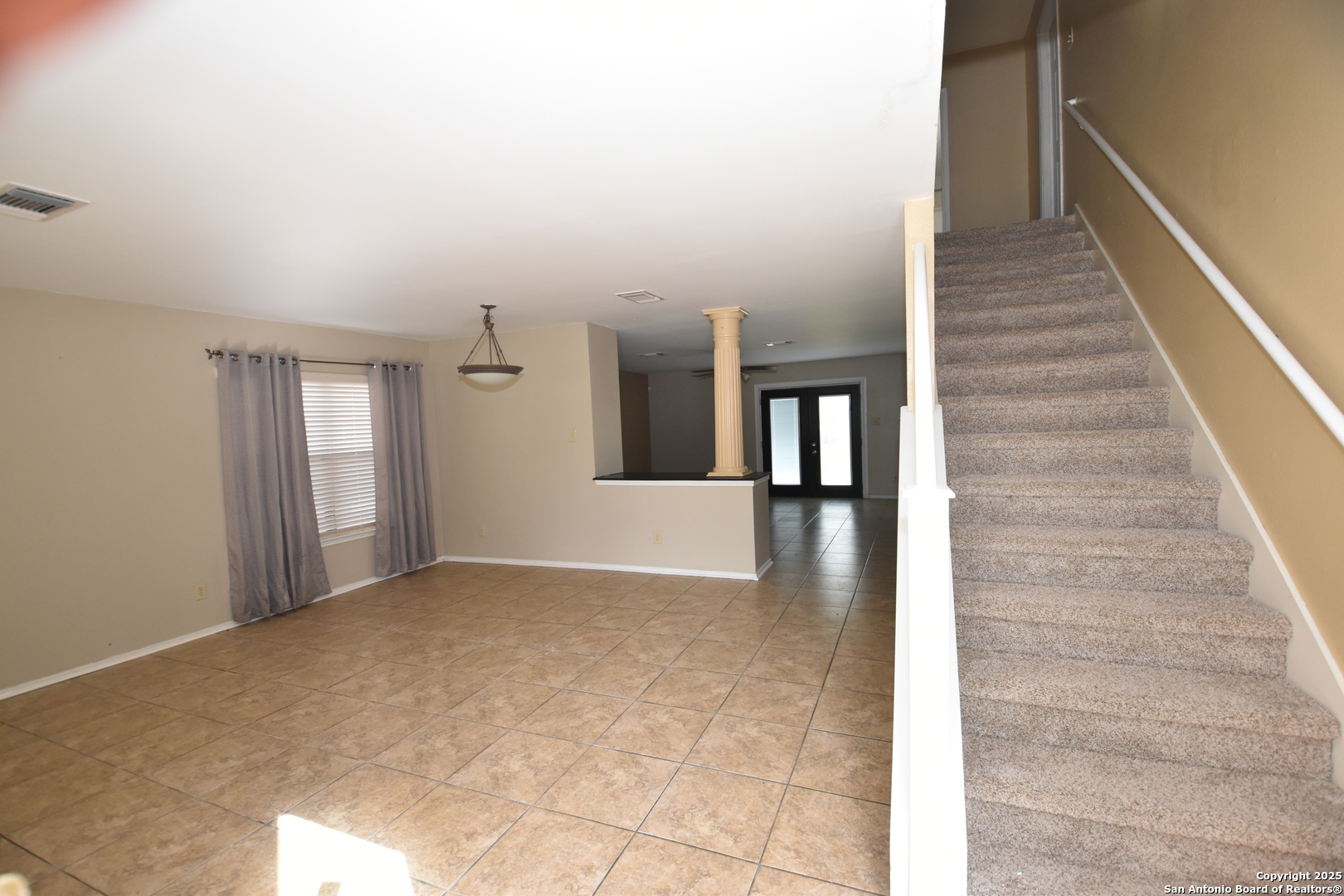 1607 Pinetum Drive San Antonio, TX 78213 - Photo 2 of 26 a view of a hallway with wooden floor and staircase