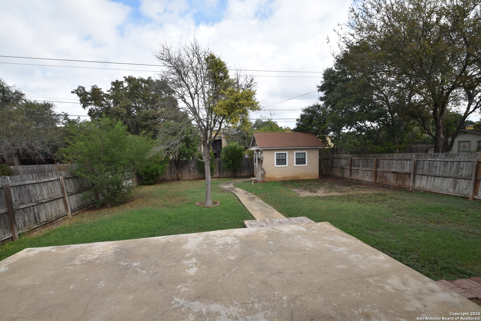 1607 Pinetum Drive San Antonio, TX 78213 - Photo 24 of 26 a view of a house with a yard