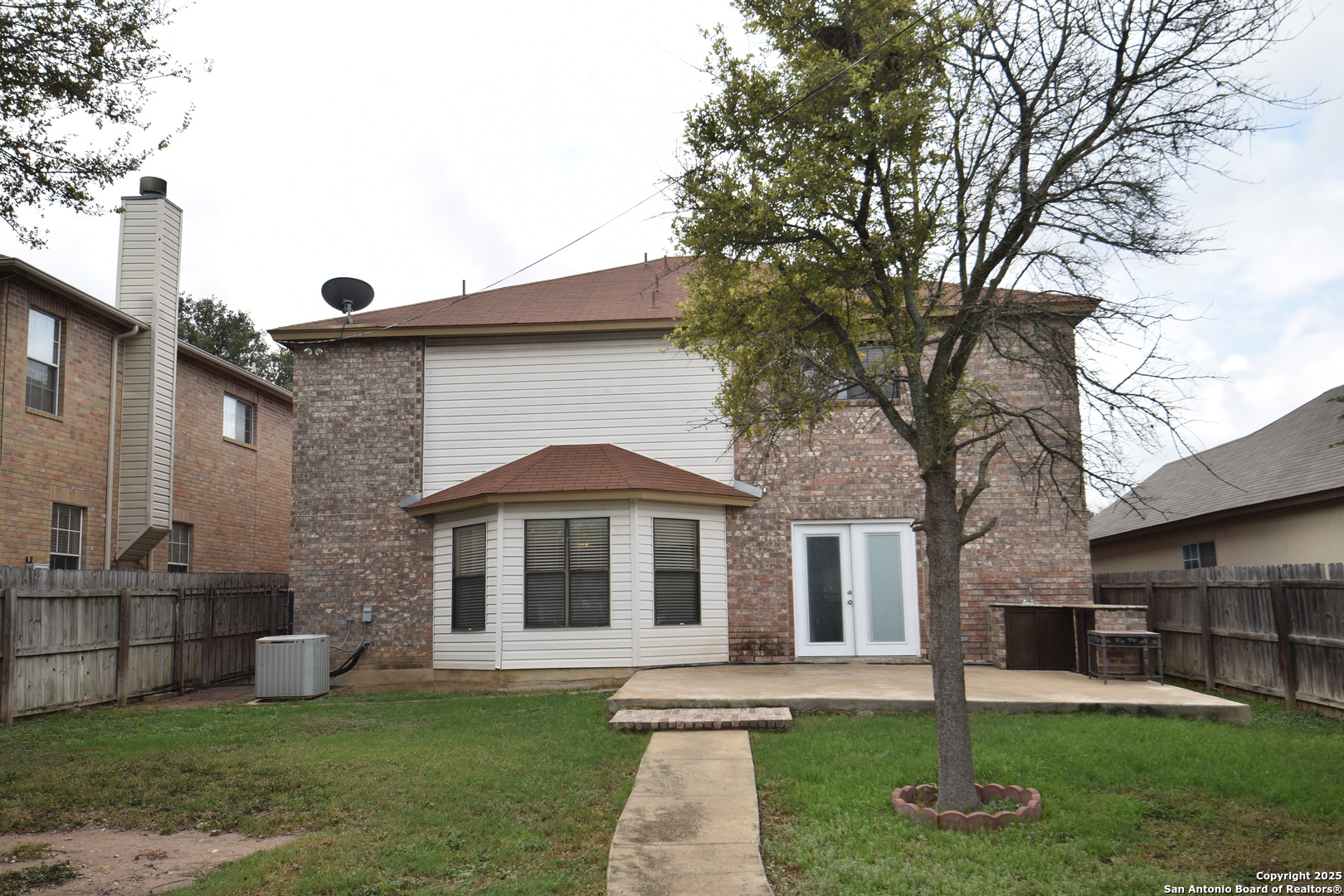 1607 Pinetum Drive San Antonio, TX 78213 - Photo 25 of 26 a front view of a brick house with a yard