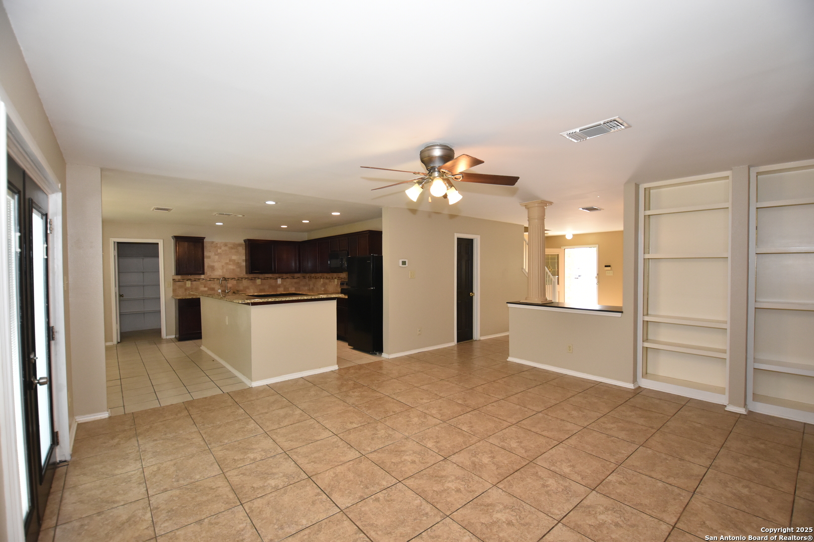 1607 Pinetum Drive San Antonio, TX 78213 - Photo 5 of 26 a view of a kitchen with microwave and refrigerator