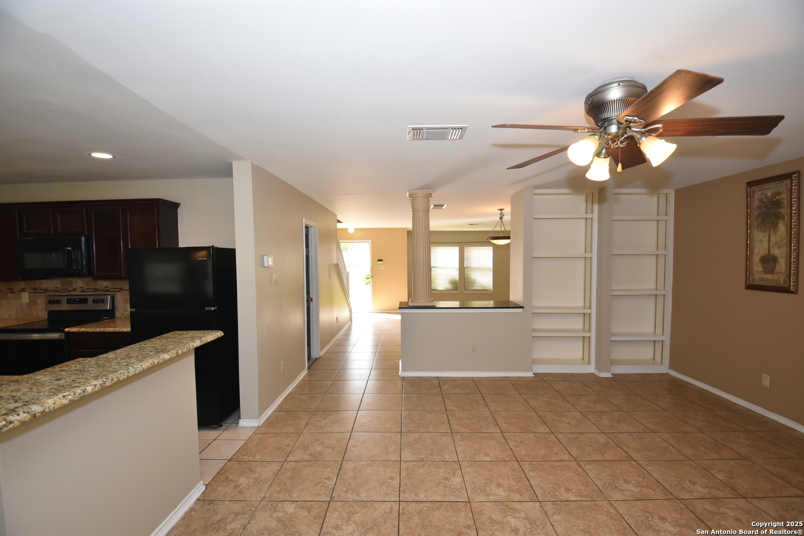 1607 Pinetum Drive San Antonio, TX 78213 - Photo 7 of 26 a kitchen with stainless steel appliances kitchen island granite countertop a refrigerator and a sink