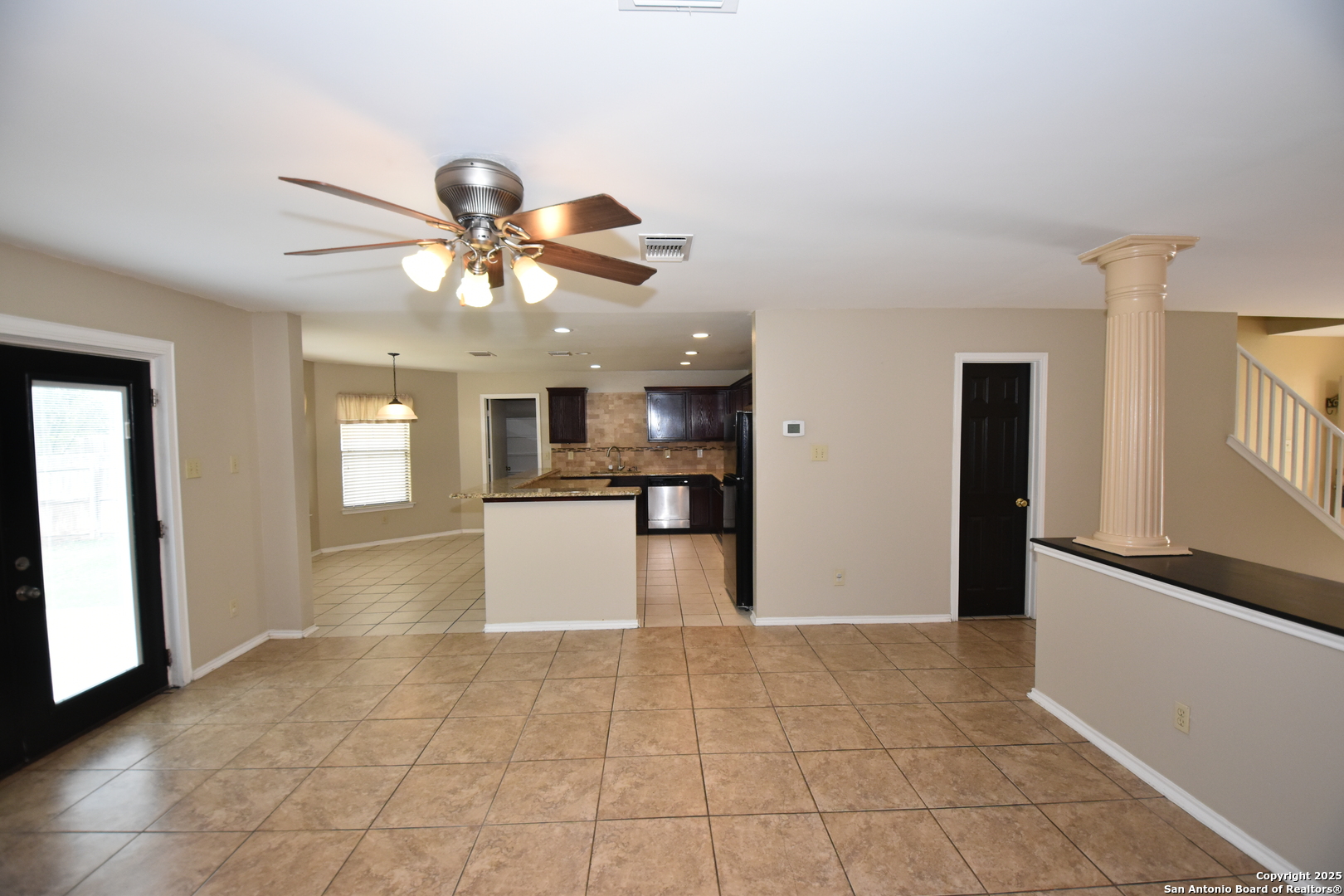 1607 Pinetum Drive San Antonio, TX 78213 - Photo 8 of 26 a view of a kitchen with an empty space and a kitchen