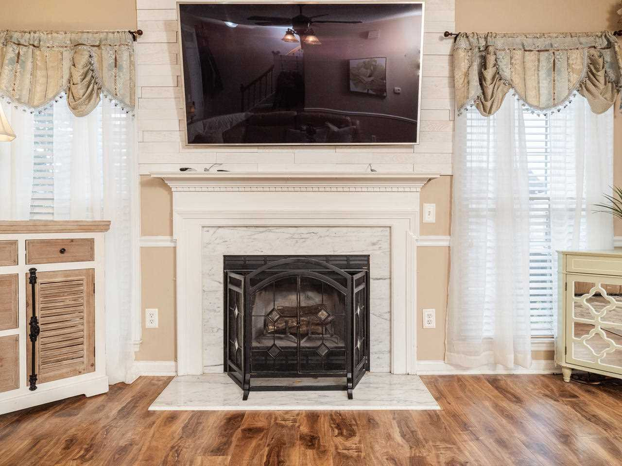 8604 Harps Mill Road Raleigh, NC 27615 - Photo 17 of 26 Wood burning fireplace w/shiplap detail