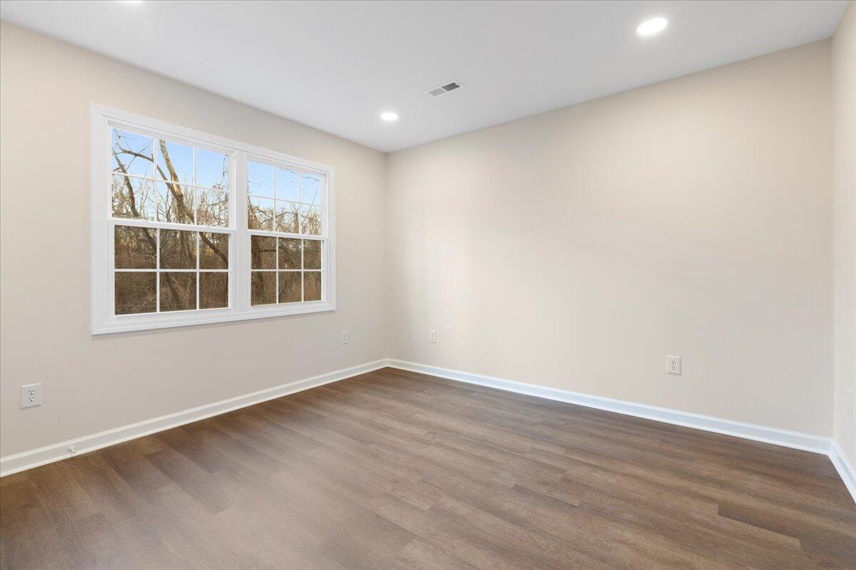 127 State Pulaski, VA 24301 - Photo 25 of 35 an empty room with wooden floor and windows
