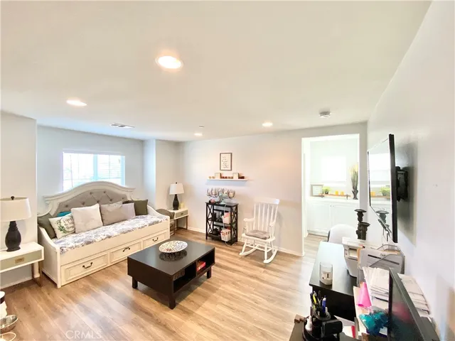 a large white kitchen with a large window
