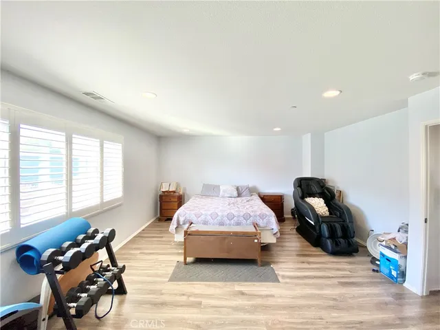 a bathroom with a tub a sink a mirror and a shower