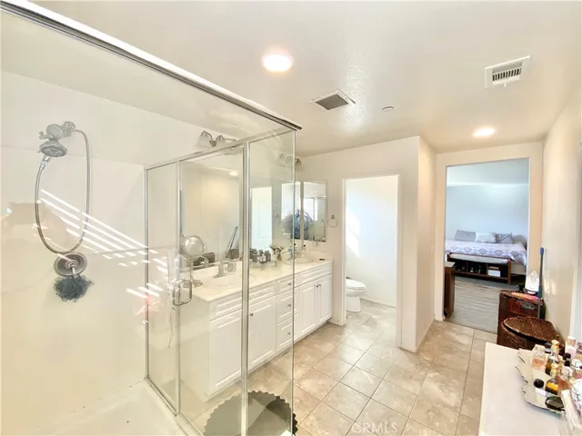 a view of a pathway both side of a house