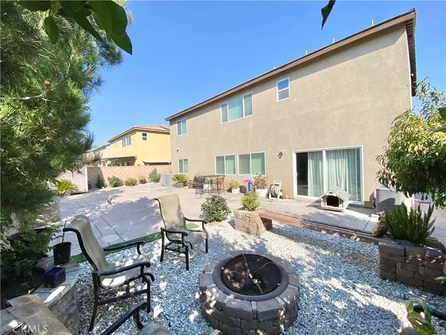 a view of a patio with chair and tables