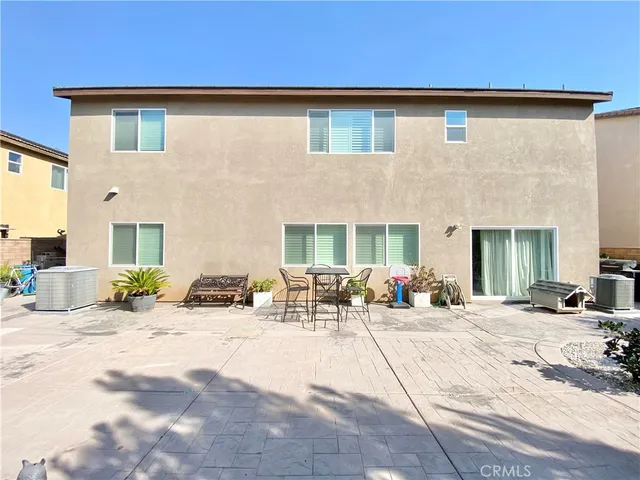 a front view of a building with outdoor seating