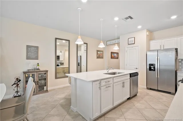 a living room with furniture a ceiling fan and a rug