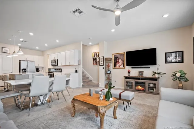 a bedroom with a bed and a flat tv screen on dresser
