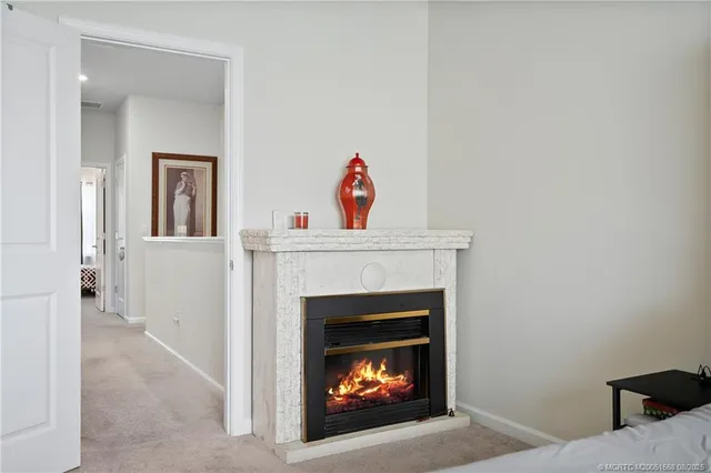 a bedroom with a bed and ceiling fan