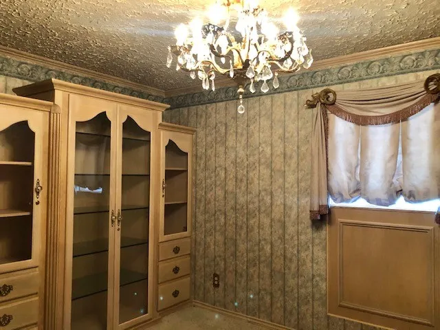 a bathroom with a granite countertop shower a sink and a mirror