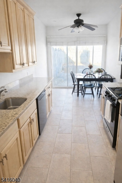 812 Old York Road Raritan, NJ 08869 - Photo 3 of 16 a kitchen with a sink a stove and a chandelier