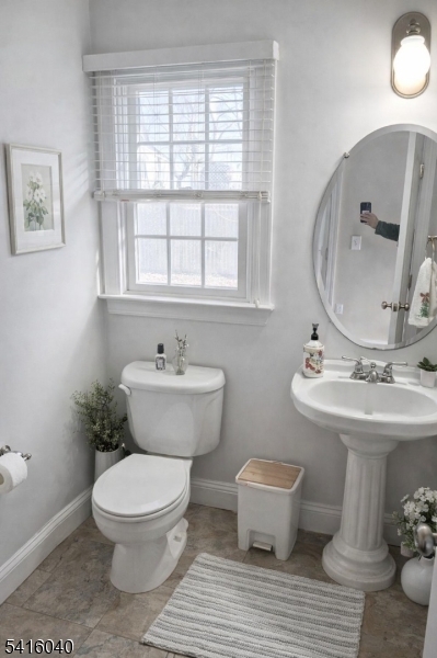 812 Old York Road Raritan, NJ 08869 - Photo 8 of 16 a bathroom with a toilet a sink and a mirror